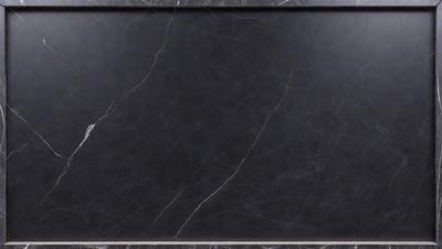 The primary subject of the image is a black marble countertop. The setting is a kitchen, with the countertop being the main focus of the scene. The visual style is a photo, capturing the marble countertop in detail. The colors and mood of the image are dark and moody, with the black marble countertop being the dominant color.