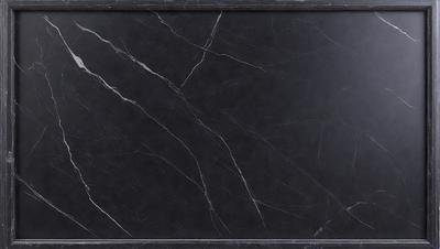The primary subject of the image is a black marble countertop. The setting is a kitchen, with the countertop being the main focus of the scene. The visual style is a close-up of the marble countertop, showcasing its texture and details. The colors and mood of the image are predominantly dark, with the black marble countertop being the main source of contrast and visual interest.