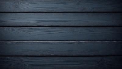 The primary subject of the image is a wooden wall. The setting is a dark room with a blue color scheme. The visual style is a close-up of the wooden wall, which gives a sense of texture and depth. The colors and mood of the image are predominantly dark and moody, with the blue color adding a touch of calmness to the scene.