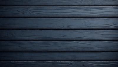 The primary subject of the image is a wooden wall. The setting is a dark room, and the visual style is a photo. The dominant colors are dark blue and black, creating a moody atmosphere.