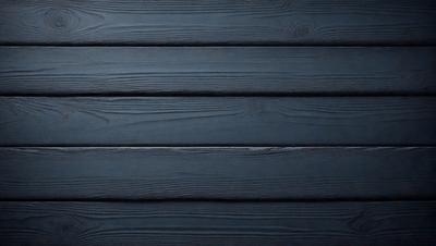 The primary subject of the image is a wooden wall. The setting is a dark room with a blue color scheme. The visual style is a close-up of the wooden wall, which gives a sense of texture and depth. The colors and mood of the image are predominantly dark and moody, with the blue color adding a touch of calmness to the scene.