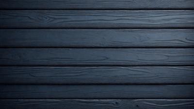 The primary subject of the image is a wooden wall. The setting is a dark room with a wooden floor. The visual style is a photo of a wooden wall. The colors and mood are dark and moody, with the wooden wall being the main focus of the image.