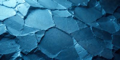 The primary subject of the image is a blue surface with a pattern of holes. The setting is a blue background, and the visual style appears to be a combination of a photo and a digital art or illustration. The dominant colors are blue and black, creating a moody atmosphere.