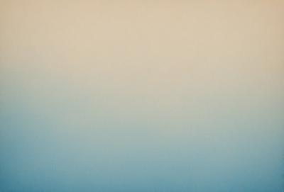 The primary subject of the image is a large, empty, and cloudy sky. The setting is a vast, open space with no visible landmarks or objects. The visual style is a natural, outdoor scene with a focus on the sky. The colors and mood of the image are predominantly blue, creating a calm and serene atmosphere.