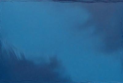 The primary subject of the image is a blue sky with clouds. The setting is a cloudy day, and the visual style is a photo. The dominant colors are blue and white, creating a calm and serene atmosphere.