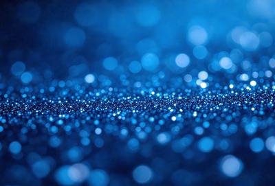 The primary subject of the image is a blue background with a pattern of blue and white dots. The setting is a dark blue background, which creates a contrast with the dots. The visual style is a digital art or illustration, as the dots are created with a computer or digital tool. The colors and mood of the image are predominantly dark blue and white, giving it a calm and serene atmosphere.