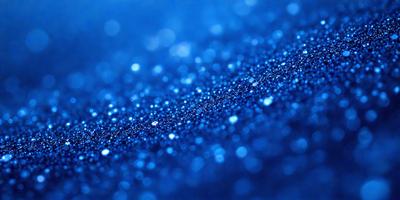 The primary subject of the image is a blue surface with a pattern of white specks. The setting appears to be a dark background, possibly a night sky. The visual style of the image is a close-up of the blue surface with the white specks, creating a unique and intriguing pattern. The colors and mood of the image are predominantly dark and moody, with the blue surface and white specks providing a contrasting and visually striking element.