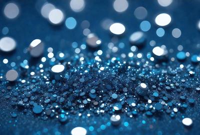 The primary subject of the image is a close-up of a blue background with a pattern of silver glittery balls. The setting is a dark blue background, which contrasts with the silver glittery balls. The visual style is a close-up of the blue background with the silver glittery balls, creating a unique and eye-catching pattern. The colors and mood of the image are predominantly dark blue and silver, giving it a sophisticated and elegant appearance.