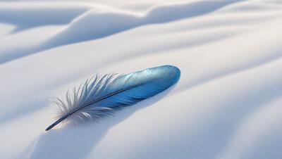 The primary subject of the image is a blue feather, which is lying on a white surface. The setting is a snowy environment, with the feather resting on a snow-covered ground. The visual style of the image is a photo, capturing the natural beauty of the feather and its surroundings. The colors in the image are predominantly white and blue, creating a serene and peaceful atmosphere.