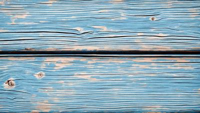 The primary subject of the image is a wooden surface with a blue color. The setting is a wooden wall, and the visual style is a photo. The dominant colors are blue and white, creating a calm and serene atmosphere.