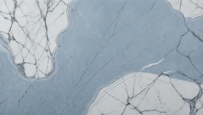 The primary subject of the image is a marble countertop with a blue and white color scheme. The setting is a kitchen or bathroom environment, with the countertop being the main focus. The visual style is a close-up of the marble countertop, showcasing its unique texture and design. The colors and mood of the image are predominantly blue and white, creating a clean and elegant atmosphere.