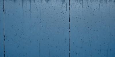 The primary subject of the image is a blue wall with a crack in it. The setting is a room with a blue wall, and the visual style is a photo. The dominant colors are blue and white, and the overall atmosphere is calm and serene.