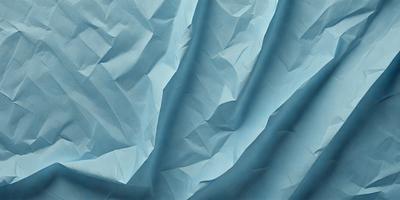 The primary subject of the image is a blue sheet of paper with a pattern of folded edges. The setting is a blue background, and the visual style appears to be a digital art or illustration. The colors and mood of the image are predominantly blue, creating a calm and serene atmosphere.
