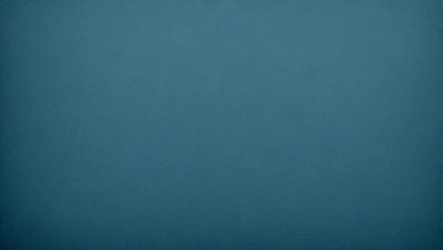 The primary subject of the image is a blue background. The setting is a dark, empty space with no visible objects or people. The visual style is a simple, monochromatic design. The colors and mood are predominantly dark and moody, with the blue background creating a sense of calmness and tranquility.