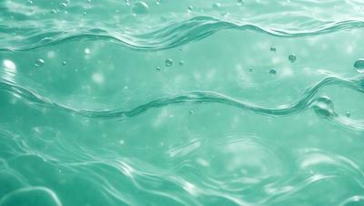 The primary subject of the image is a body of water, which appears to be a large, blue ocean. The setting is underwater, with the water surface visible. The visual style of the image is a photo, capturing the beauty of the underwater environment. The colors and mood of the image are predominantly blue, creating a serene and calming atmosphere.
