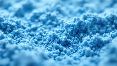 The primary subject of the image is a blue substance, which appears to be a powder or a liquid. The setting is a close-up of the blue substance, with a blue background. The visual style is a close-up of the blue substance, which gives it a digital art or illustration appearance. The dominant colors are blue, and the overall atmosphere is calm and serene.