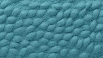 The primary subject of the image is a close-up of a blue, fuzzy, and textured surface. The setting appears to be a room with a blue carpet. The visual style is a photo, and the dominant colors are blue and white. The overall atmosphere is soft and cozy, with a focus on the intricate texture of the carpet.
