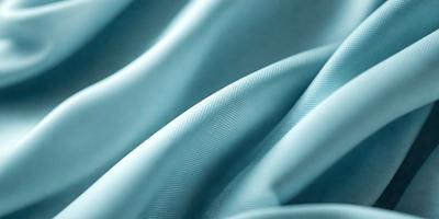 The primary subject of the image is a blue fabric, possibly a piece of cloth or a curtain. The setting is a room with a blue background, which creates a cohesive and visually appealing environment. The visual style of the image is a close-up of the blue fabric, showcasing its texture and details. The colors and mood of the image are predominantly blue, giving it a calm and serene atmosphere.