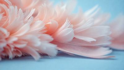 The primary subject of the image is a pink feather, which is the main object in the scene. The setting is a blue surface, which serves as the backdrop for the feather. The visual style of the image is a close-up of the feather, showcasing its details and texture. The dominant colors in the image are pink and blue, creating a soft and delicate atmosphere.