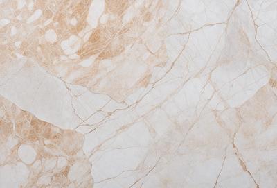 The primary subject of the image is a marble wall with a white and brown color scheme. The setting is a room with a white marble wall, and the visual style is a close-up of the wall. The colors and mood of the image are warm and inviting, with the marble wall providing a natural and elegant appearance.