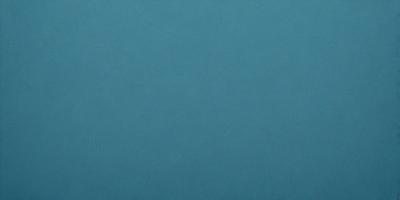 The primary subject of the image is a large, dark blue surface. The setting is a dark blue background, and the visual style is a photo. The colors and mood of the image are predominantly dark blue, creating a calm and serene atmosphere.