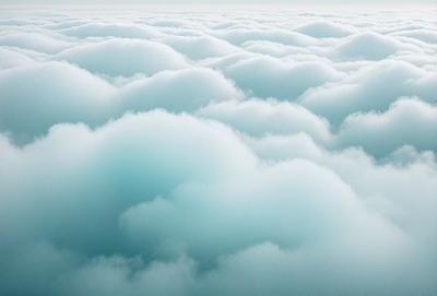 The primary subject of the image is a cloudy sky filled with clouds. The setting is a vast, open space with no visible landmarks or objects. The visual style is a natural, outdoor scene with a focus on the clouds. The colors and mood of the image are predominantly blue and white, creating a serene and peaceful atmosphere.