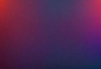 The primary subject of the image is a purple background. The setting is a dark, empty room with a purple wall. The visual style is a close-up of the purple wall, which gives the image a moody and atmospheric feel. The colors and mood of the image are dominated by the purple hue, creating a sense of depth and mystery.