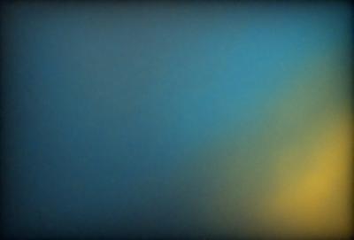 The primary subject of the image is a blue sky with a yellow sunset. The setting is a clear day with a beautiful sunset in the background. The visual style is a natural, outdoor scene with a focus on the sky and sunset. The colors and mood of the image are serene and calming, with the blue sky and yellow sunset creating a peaceful atmosphere.