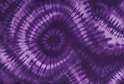 Purple tie dye fabric with a swirl pattern.