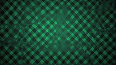 The primary subject of the image is a green and black checkered pattern. The setting is a wall, and the visual style is a patterned background. The colors and mood of the image are predominantly green and black, creating a bold and striking appearance.