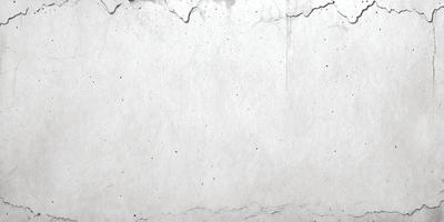 The primary subject of the image is a white wall with a few black spots. The setting is a room with a white wall, and the visual style is a photo. The colors and mood of the image are predominantly white and black, creating a stark and minimalist atmosphere.