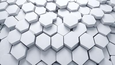 The primary subject of the image is a white hexagonal pattern, which is the main focus of the image. The setting is a white wall, and the visual style is a close-up of the hexagonal pattern. The colors and mood of the image are predominantly white, giving it a clean and minimalist appearance.