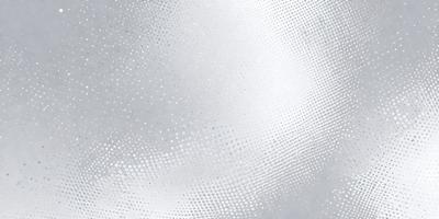 The primary subject of the image is a silver surface, which appears to be a metal or a shiny material. The setting is a cloudy sky, and the visual style is a close-up of the silver surface. The colors in the image are predominantly silver and white, creating a calm and serene atmosphere.