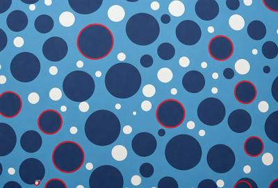 The primary subject of the image is a blue and white polka dot pattern. The setting is a blue background, and the visual style appears to be a digital art or illustration. The dominant colors are blue and white, creating a calm and soothing atmosphere.