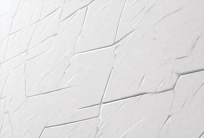 The primary subject of the image is a white wall with a textured surface. The setting is a room with a white wall, and the visual style is a close-up of the wall. The colors and mood of the image are predominantly white, giving it a clean and minimalist appearance.