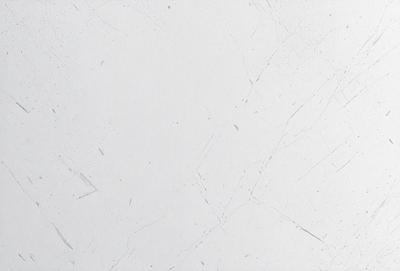 The primary subject of the image is a white wall with a marble texture. The setting is a room with a white background. The visual style is a close-up of the wall, showcasing its texture and design. The colors and mood of the image are predominantly white, giving it a clean and minimalist appearance.