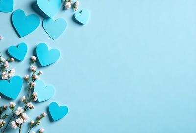 The primary subject of the image is a collection of blue hearts arranged on a blue wall. The hearts are placed in various positions, creating a visually appealing display. The setting is a blue wall, which serves as the backdrop for the hearts. The visual style of the image is a combination of digital art and illustration, as the hearts are created using a digital medium. The dominant colors in the image are blue and white, giving the scene a calm and serene atmosphere.