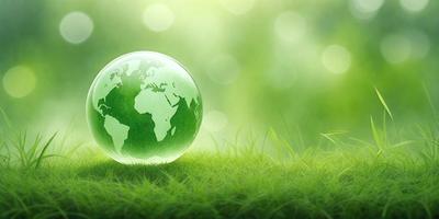 The primary subject of the image is a green globe, which is the main object, scene, or focus of the image. The setting/background consists of a lush green field, and the visual style is a photo. The colors and mood of the image are predominantly green, creating a serene and natural atmosphere.
