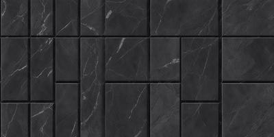The primary subject of the image is a black marble tile. The setting is a black and white photo of the tile, which gives it a classic and elegant appearance. The visual style is a close-up of the tile, showcasing its intricate details. The colors and mood of the image are predominantly black and white, creating a timeless and sophisticated atmosphere.