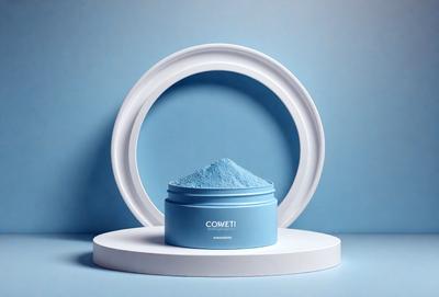 The primary subject of the image is a blue jar filled with a powdery substance, likely a powdered drink mix. The jar is placed on a white surface, which serves as the background. The visual style of the image is a close-up of the jar, showcasing the powdery substance inside. The colors in the image are predominantly blue and white, creating a calm and soothing atmosphere.