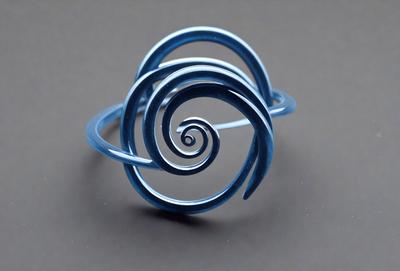 The primary subject of the image is a blue spiral ring. The setting is a gray background, which provides a contrasting backdrop for the ring. The visual style is a close-up of the ring, showcasing its intricate design. The colors and mood of the image are predominantly blue, giving it a calm and serene atmosphere.
