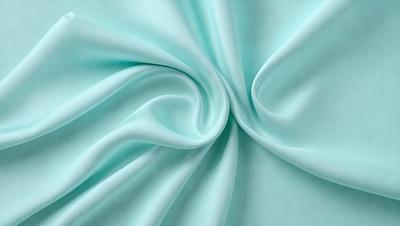 The primary subject of the image is a piece of blue fabric, which is the main object, scene, or focus of the image. The setting or background of the image is a blue cloth, and the visual style appears to be a photo. The dominant colors in the image are blue, and the overall atmosphere is calm and serene.