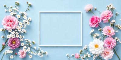 The primary subject of the image is a white frame with a blue background. The setting is a flower-filled garden, with pink and white flowers surrounding the frame. The visual style is a combination of a photo and digital art, creating a vibrant and lively atmosphere. The colors and mood of the image are predominantly white and pink, giving it a fresh and delicate appearance.
