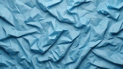 The primary subject of the image is a blue paper, which is the main object, scene, or focus of the image. The setting is a blue background, and the visual style is a photo. The colors and mood of the image are predominantly blue, creating a calm and serene atmosphere.