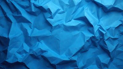 The primary subject of the image is a blue paper, which is the main object, scene, or focus of the image. The setting is a blue background, and the visual style is a photo. The dominant colors are blue and white, creating a calm and serene atmosphere.