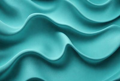 The primary subject of the image is a blue, textured surface that resembles a wave or a ripple. The setting is a blue background, and the visual style appears to be a photo or a digital artwork. The dominant colors are blue and turquoise, creating a calm and soothing atmosphere.