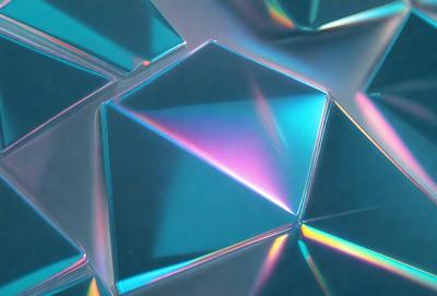 The primary subject of the image is a close-up of a blue and pink glass cube. The setting is a white background, which provides a clean and uncluttered environment for the glass cube. The visual style is a combination of photo and digital art, as the glass cube appears to be a 3D model or a digital rendering. The dominant colors in the image are blue and pink, creating a vibrant and lively atmosphere.
