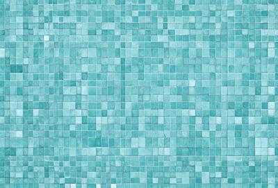 The primary subject of the image is a blue tile wall with a pattern of blue squares. The setting is a bathroom, as indicated by the blue tiles. The visual style is a close-up of the blue tiles, showcasing the pattern and texture of the wall. The dominant colors are blue, and the overall atmosphere is calm and soothing.