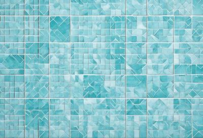 The primary subject of the image is a blue tile wall with a pattern of triangles. The setting is a room with a blue tile floor. The visual style is a close-up of the blue tile wall, showcasing the intricate pattern of triangles. The colors and mood of the image are predominantly blue, creating a calm and serene atmosphere.
