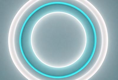 The primary subject of the image is a large, round, blue light source. The light appears to be a circle or a ring, and it is illuminating the surrounding area. The setting is a white background, which provides a clean and minimalistic appearance. The visual style of the image is a combination of a photo and digital art, as it captures the light source in a realistic manner while also showcasing its unique and artistic qualities. The colors and mood of the image are predominantly blue, creating a